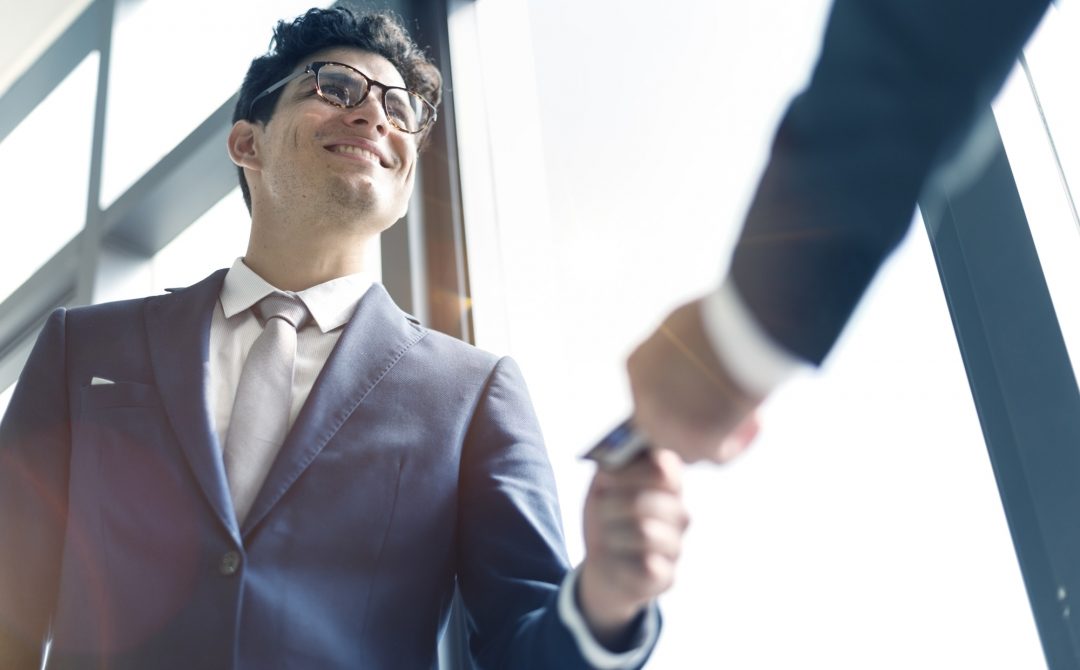Business Men Exchanging Business Card